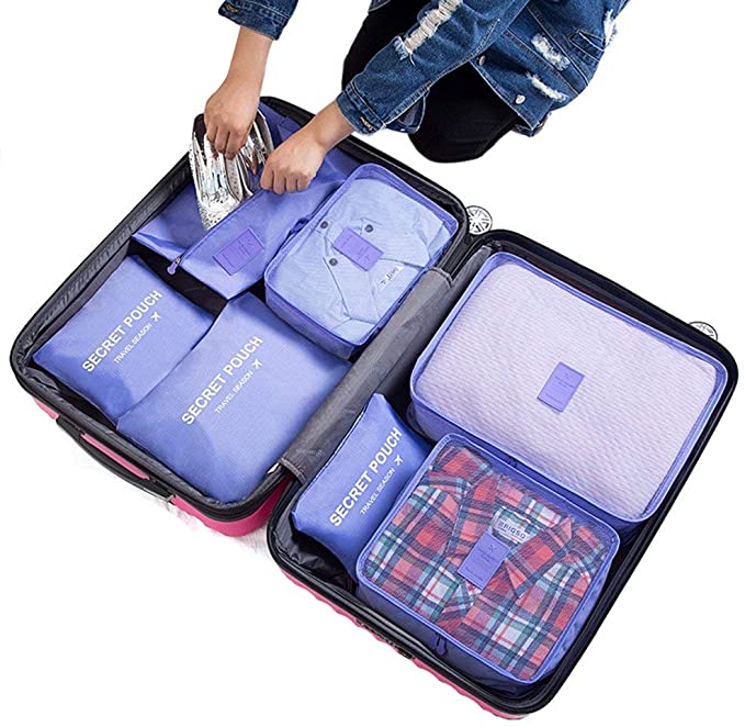 Packing a suitcase. Globe Trotsky offer packing tips and hacks for every journey.